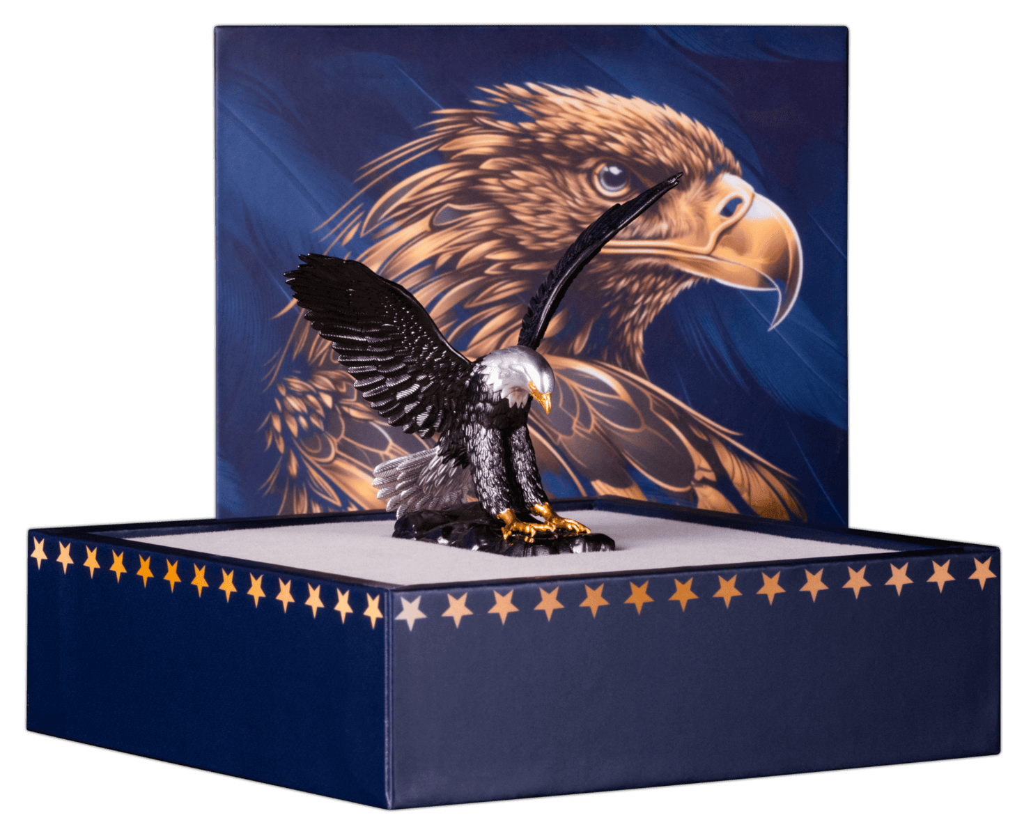 The three-dimensional, eagle-shaped coin is displayed on a textured pedestal inside its open collector's box. The eagle's body is dark, with gilded gold beak and talons. The inside of the box is a dark color, and a certificate of authenticity is visible on the left.