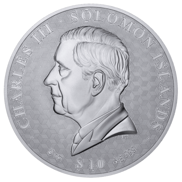 A close-up, black-and-white photograph of a large, circular silver coin. The coin's design features the bust of King Charles III in profile, facing left, with his name and regnal title inscribed around the top edge.
