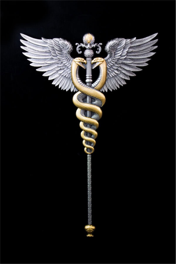 A silver-gilded winged staff with two serpents intertwined around it, shown from the back.