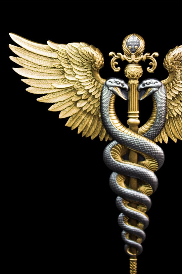 A close-up, high-detail shot of a winged staff with two serpents intertwined around it.