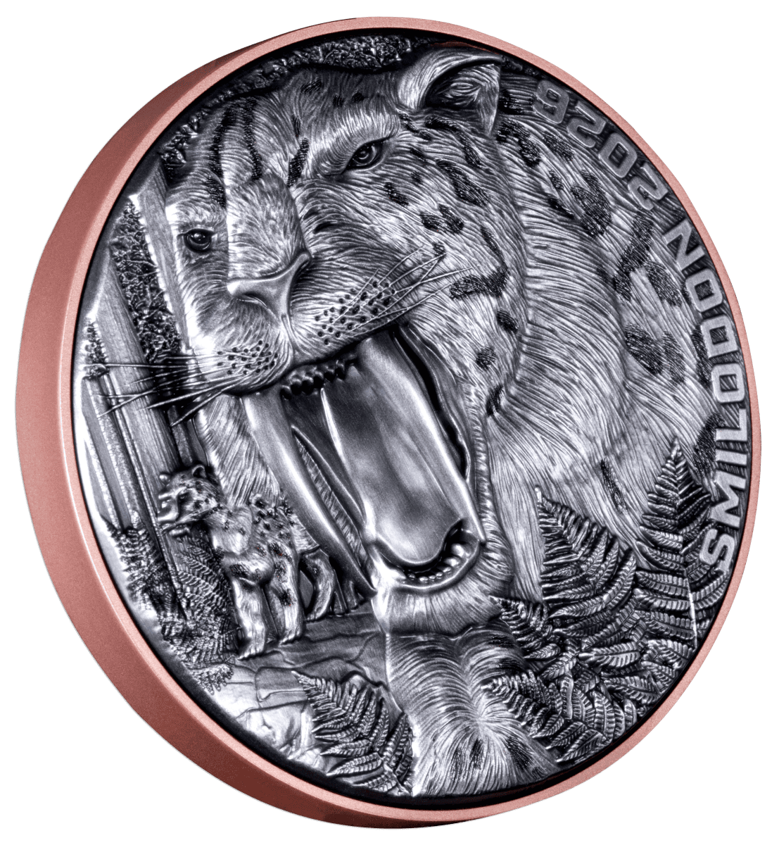 A close-up photograph of a circular, two-toned coin with an antiqued finish. The center design, which appears to be copper or bronze, shows a detailed, menacing smilodon (saber-toothed cat) with its mouth open, surrounded by a silver outer ring.