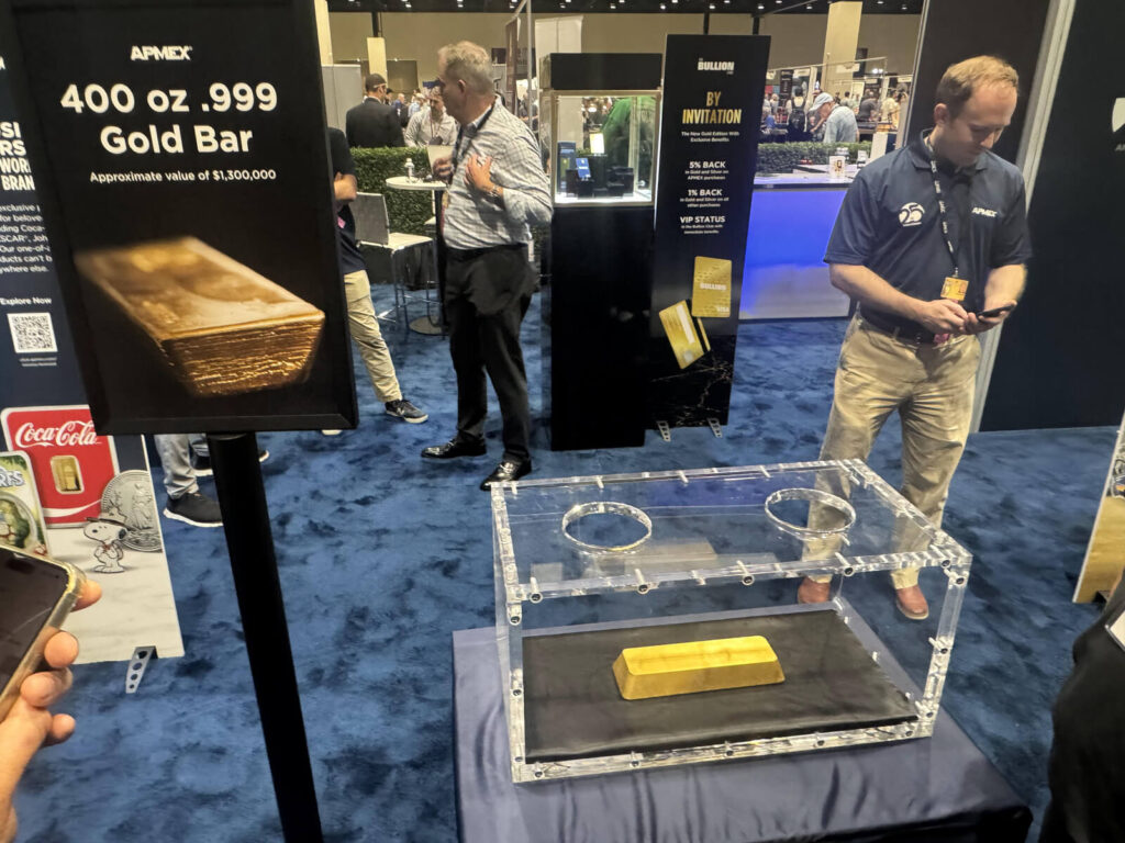 APMEX booth 400 ounce gold bar display worth 1.3 million dollars at 2025 ANA World's Fair of Money Oklahoma City Convention Center