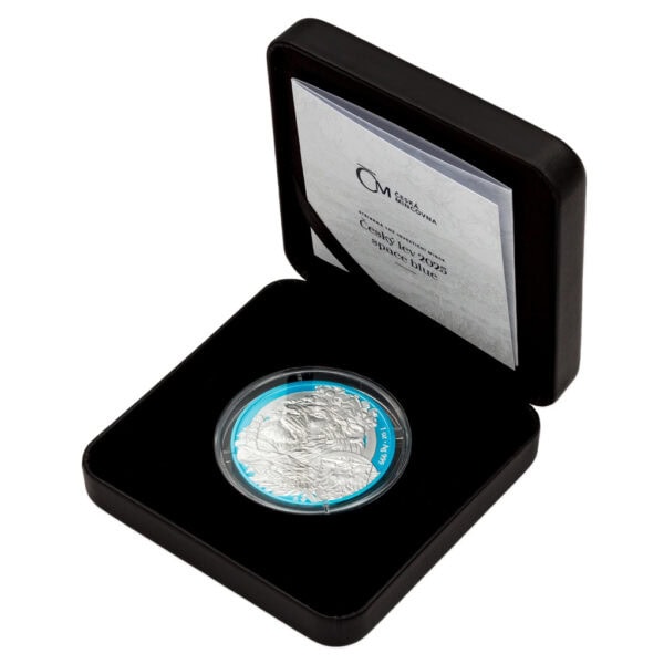 Open black presentation box displaying 2025 Niue Czech Lion silver coin with Space Blue accents, featuring detailed lion design and certificate insert in lid.