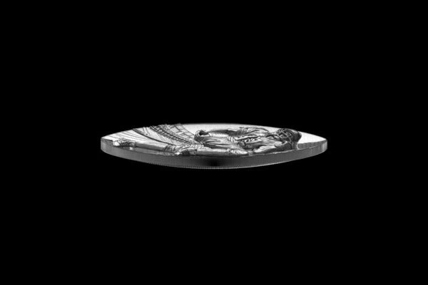 Ancient silver coin with detailed religious imagery, featuring a central figure surrounded by intricate patterns, from the early 5th century.