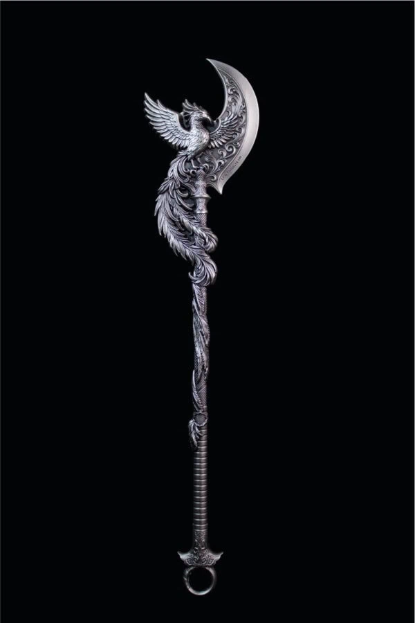 Ornate silver dagger with bird and moon motif, intricate engraved details, and a loop handle, vintage fantasy-inspired collectible.