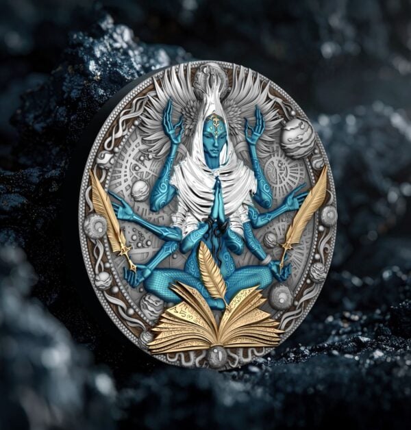A coin featuring a multi-armed blue figure with gilded elements, including an open book and feathers, presented on a dark, textured background. The coin is slightly turned to the left.