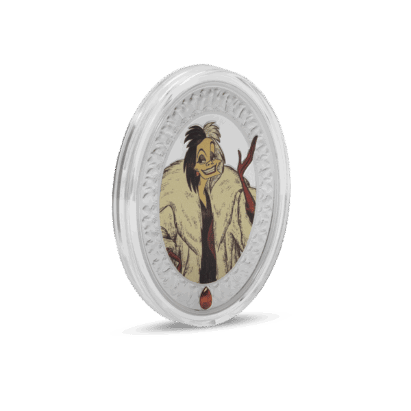 A 2025 Niue Disney Villains Cruella de Vil coin inside its clear plastic protective capsule. The image shows the oval-shaped coin with its colorized front and a small red jewel at the bottom, all encased in the capsule.