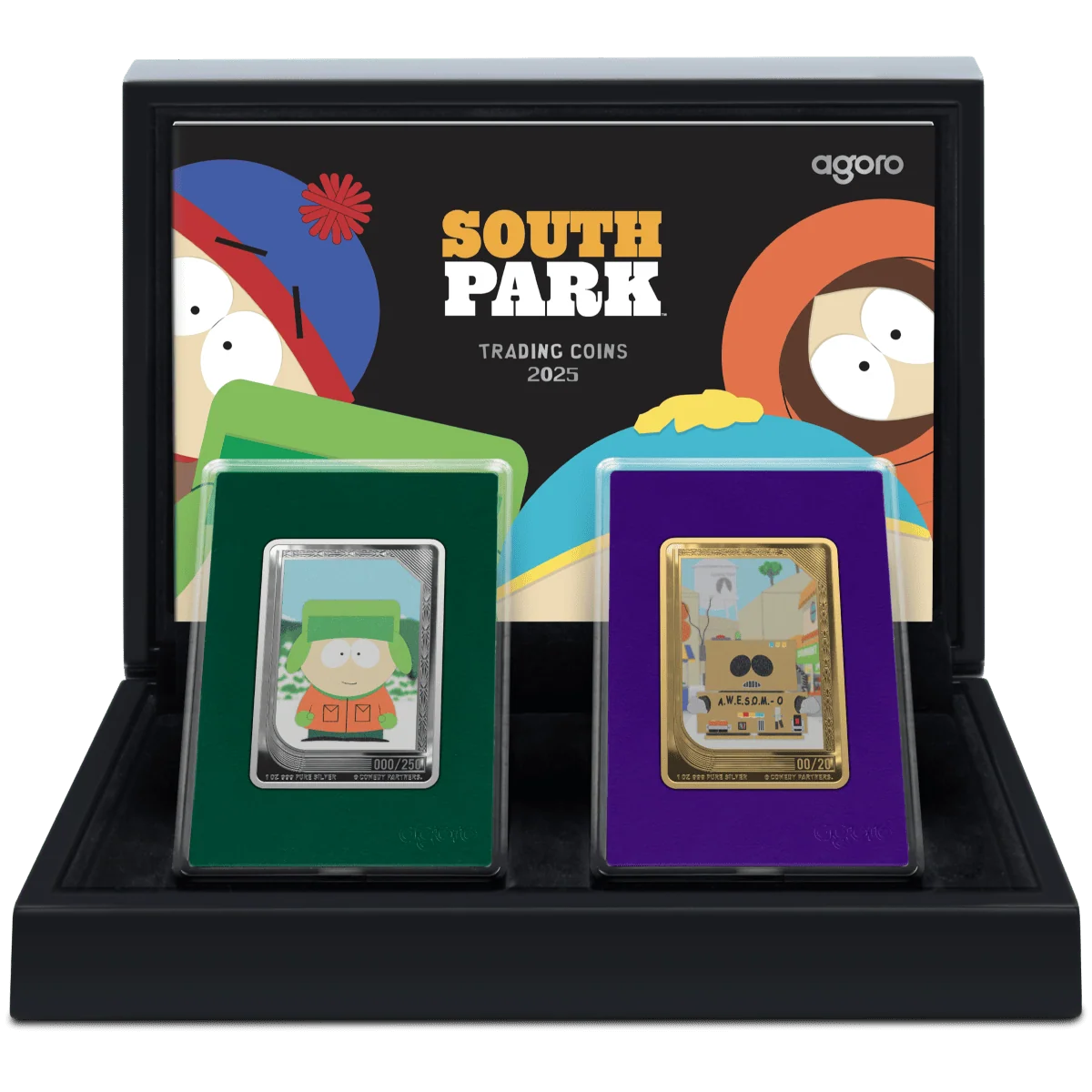 A close-up image of a South Park-themed coin set. Two rectangular, silver-colored coins are displayed in a black box with the show's logo and character art on the inside lid. The coin on the left shows an image of a character, and the one on the right shows a different one