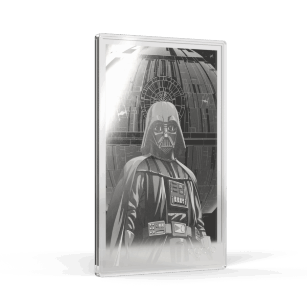 A silver proof foil featuring Darth Vader in a black and white image. The foil is tilted to show the left side and front, with the image of Darth Vader visible through the translucent packaging. He is standing, facing forward in his full armor.