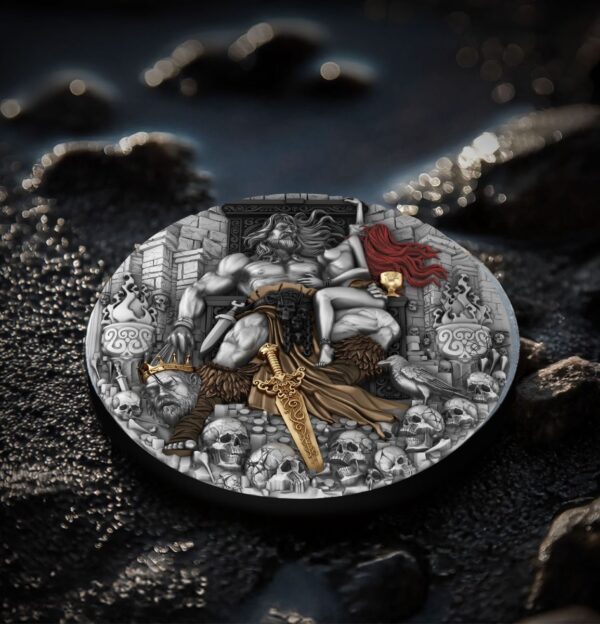 Intricately designed collectible coin featuring a detailed depiction of King Arthur seated on the throne, surrounded by skulls, swords, and medieval symbols, with gold accents on the sword and chalice.