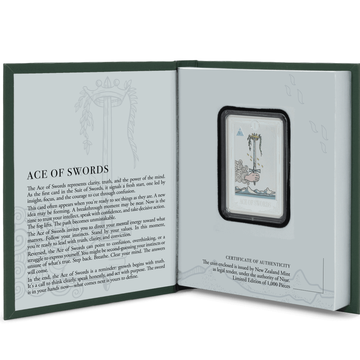 Coins and collectibles in a display case with a card describing the Ace of Swords from a card set.