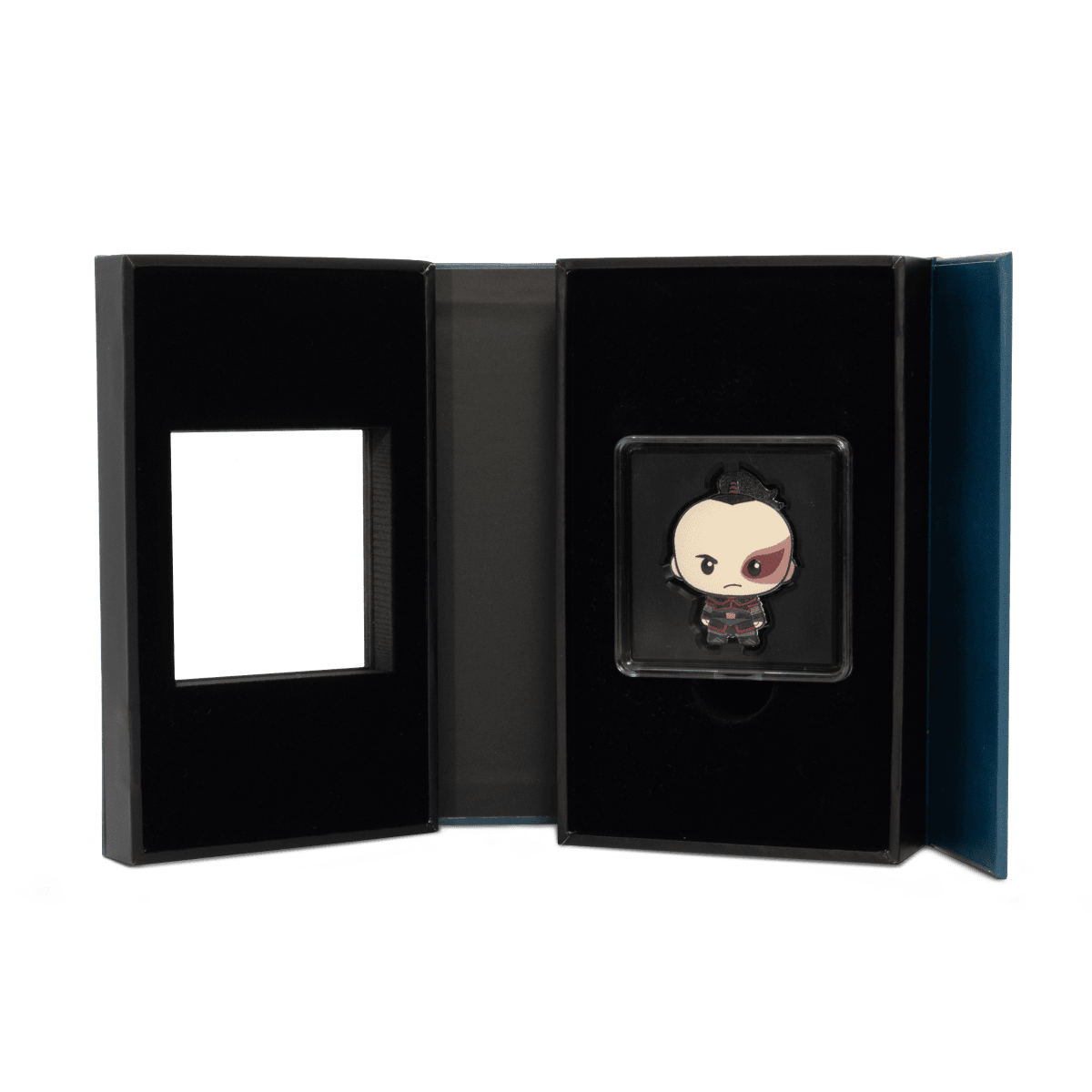 Miniature collectible coin featuring a chibi-style character in a presentation box, with distinctive facial features and detailed costume design.