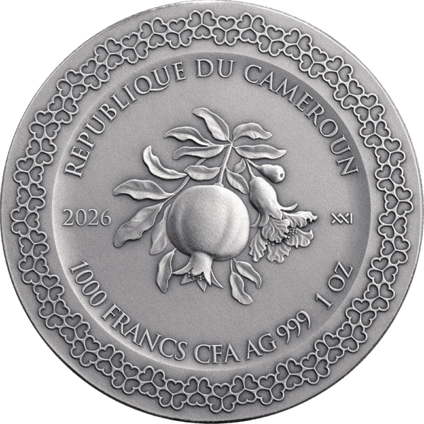 Vintage Cameroonian gold coin featuring pomegranate and floral design.