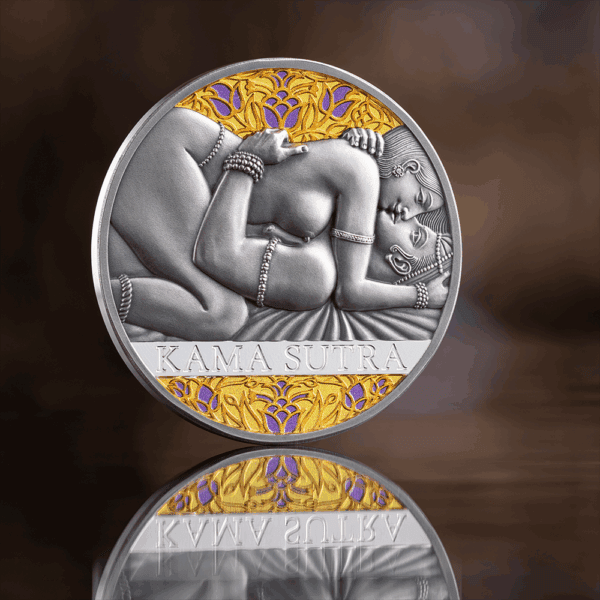 Shiva Lingam medallion showcasing intricate silver and gold design with "Kama Sutra" engraving.