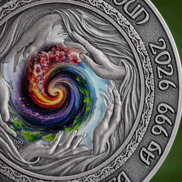 Vibrant swirling color design on a silver coin representing artistry and creativity.