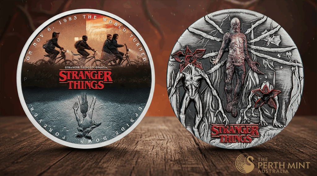 1985 Stranger Things collectible coin featuring characters riding bikes, with upside-down reflection and branding on the front.