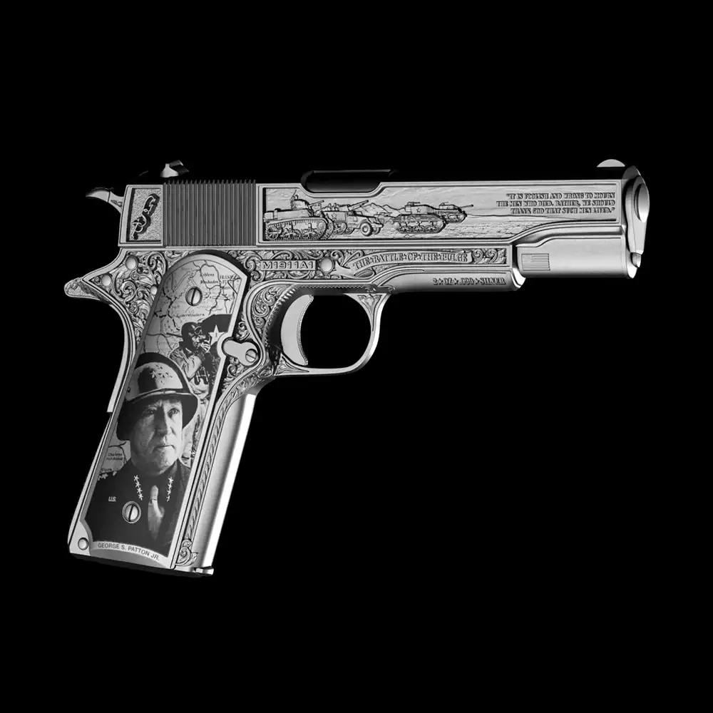Detailed 3D-shaped silver coin featuring General Patton's pistol with historical engravings and high relief design.