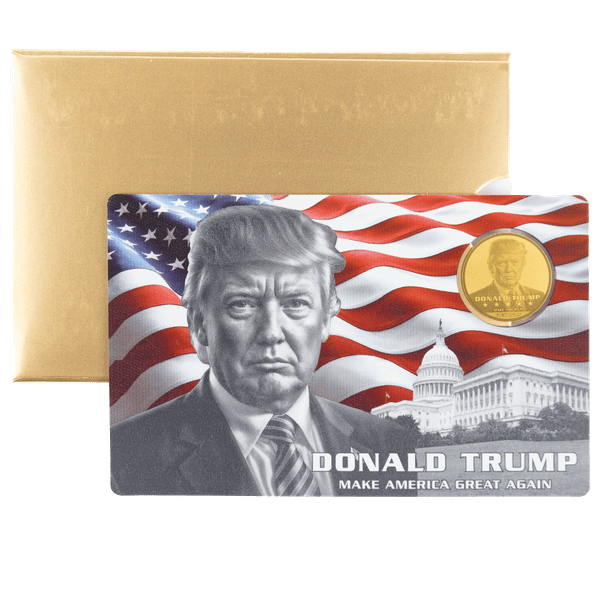 Gold coin featuring Donald Trump with American flag background, in assay card.