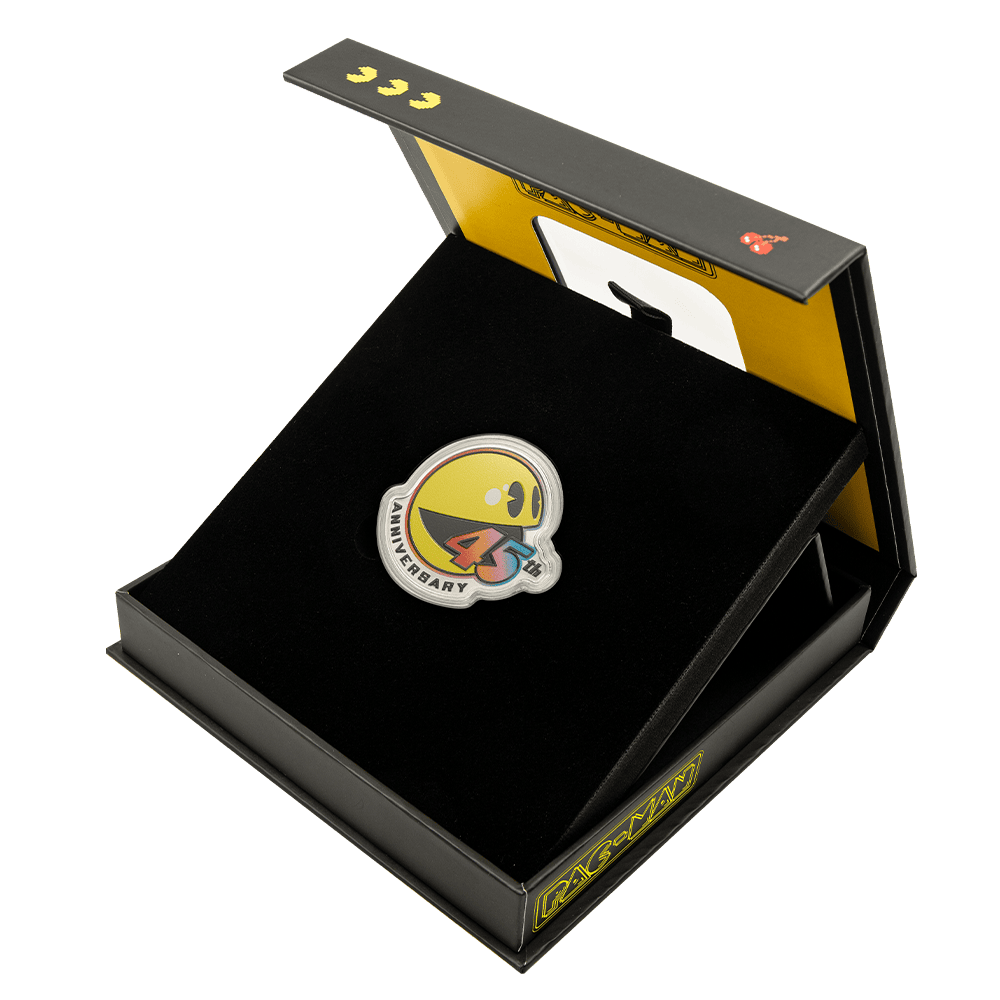 A colorful 45th anniversary coin inside a black display box with a plush interior.