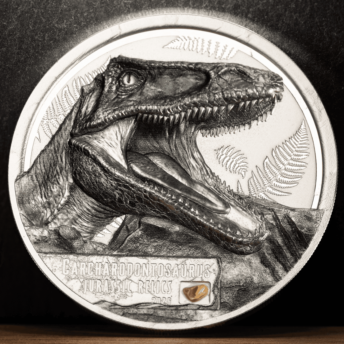 Crucial angle, 2026, mintage by GR, 1 oz silver, colorized Carcharodontosaurus relic coin, Jurassic theme, collecti.