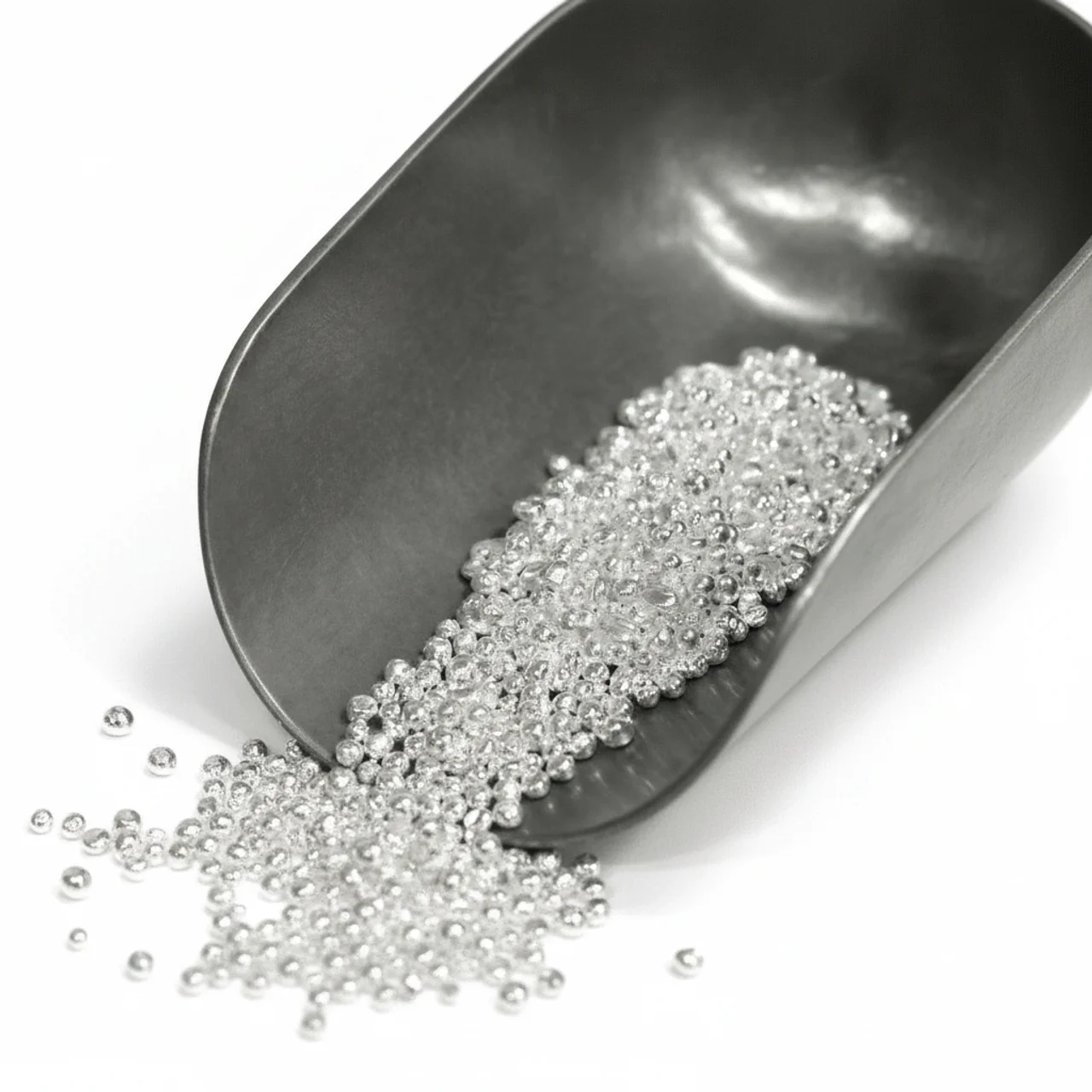 Shiny silver grains in a metal scoop, 2023, minted by the Royal Mint, 1 oz of .999 pure silver, showcasing a luxuri.