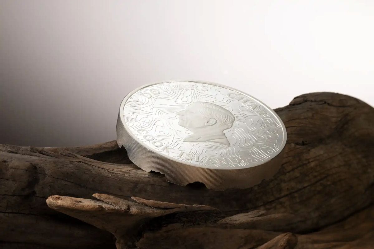 Close-up of 1kg Yellowstone topography silver coin, minted in 2023, showcasing detailed terrain from a side angle.