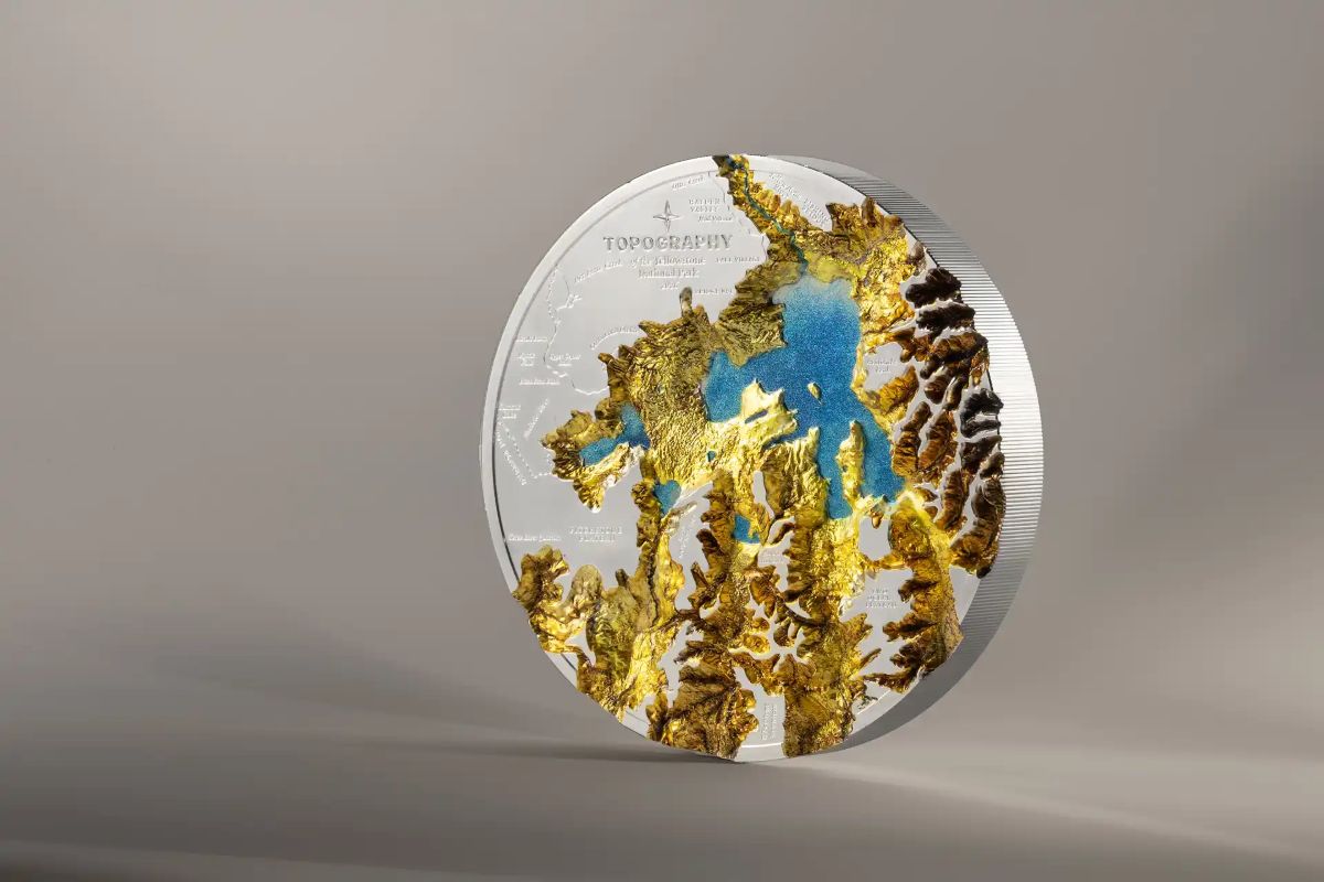 Intricate Yellowstone topography silver coin, 2023, minted by US Mint, 1kg, showcasing detailed landscape features.