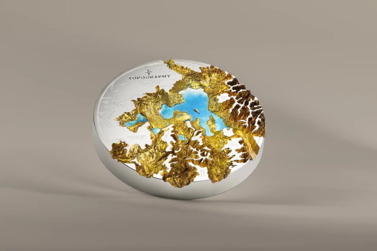 Round Yellowstone-themed gold and silver coin, 2023, minted by US Mint, 1kg, showcasing topography details and natu.