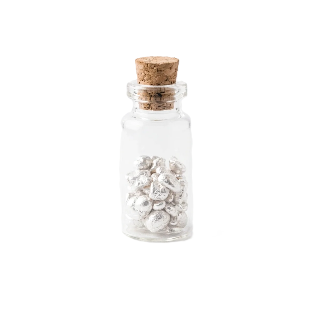 Shiny .999 silver grains in a small glass vial with cork stopper, viewed from a straight-on angle, produced in 2023.