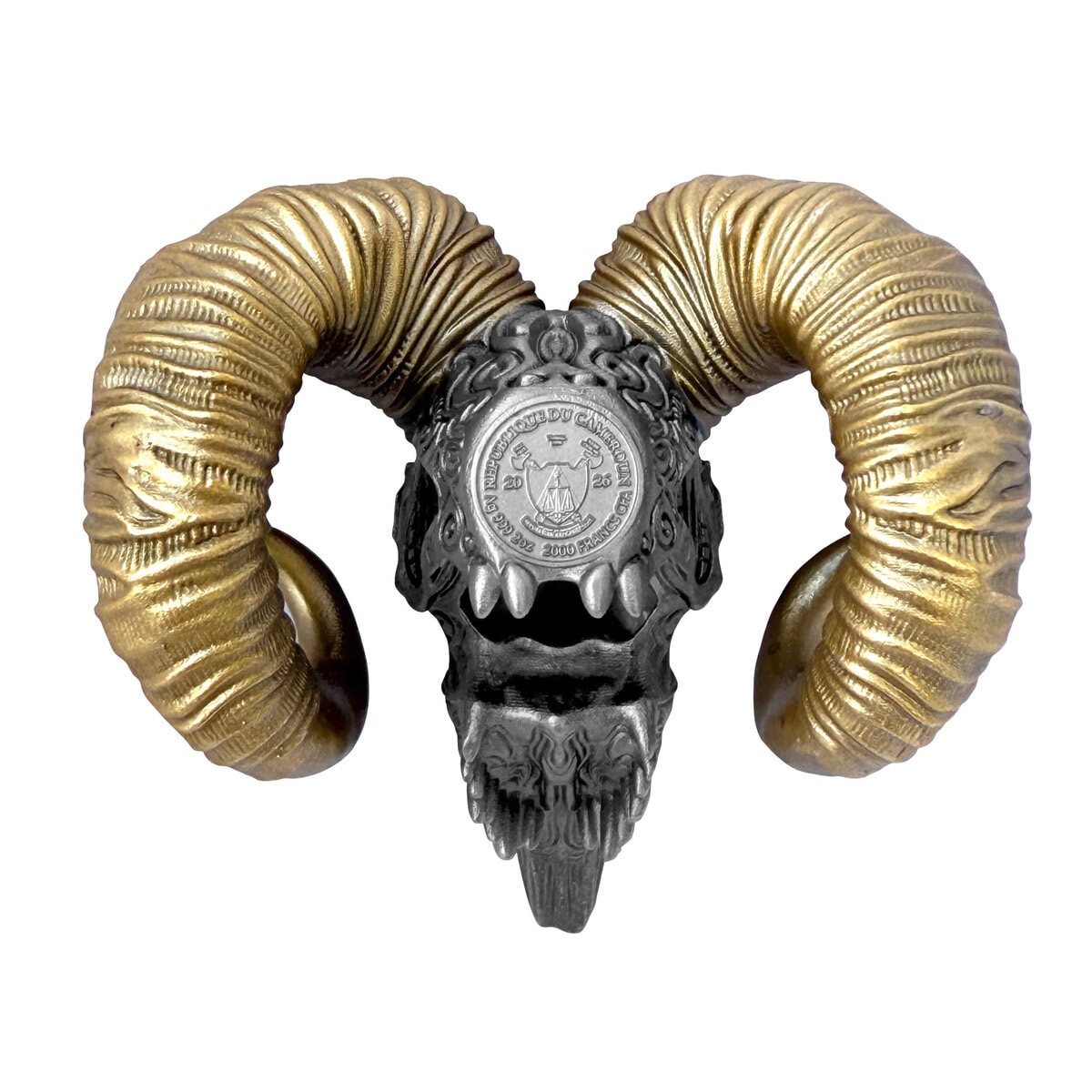 Intricately carved silver coin featuring a skull with large, curved gold horns and detailed engravings, showcasing.
