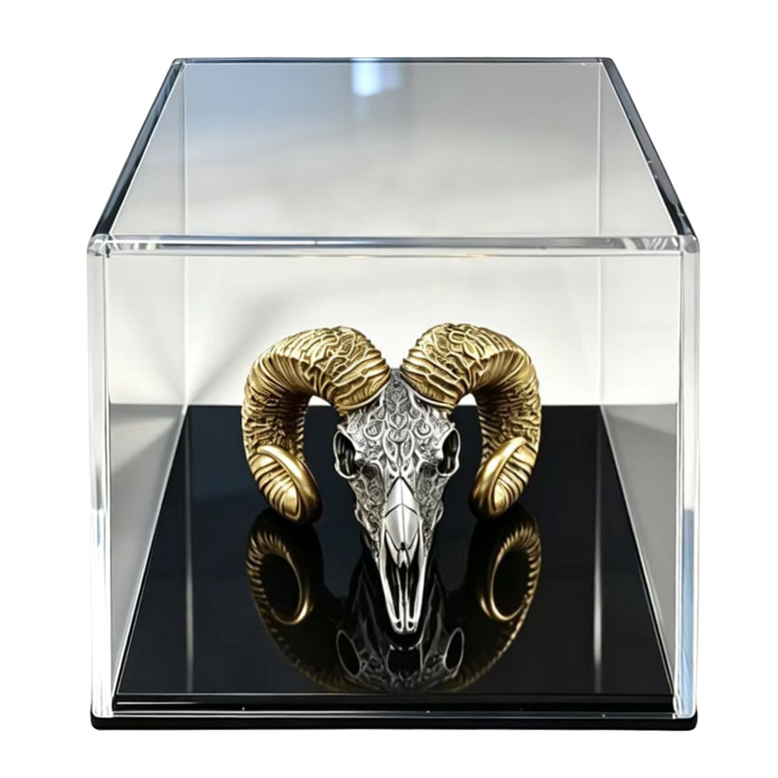 Intricately carved skull with gold-toned horns displayed in a clear acrylic case for the 2026 Cameroon Silver Coin.
