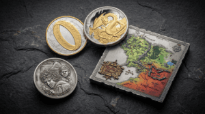 Collection of Lord of the Rings themed silver coins and a map on a dark textured surface.