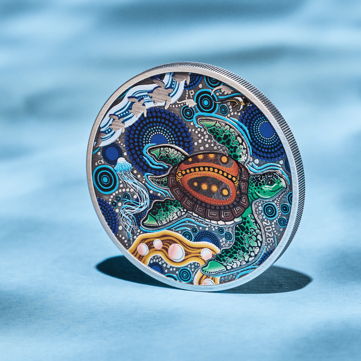 Turtle Yaunati antiqued silver coin standing on edge, colorized turtle reverse facing forward.