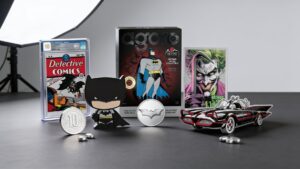 Batman silver foils, shaped silver coins, Batmobile, blind box, and modern Batman silver collectibles arranged on a collector display surface