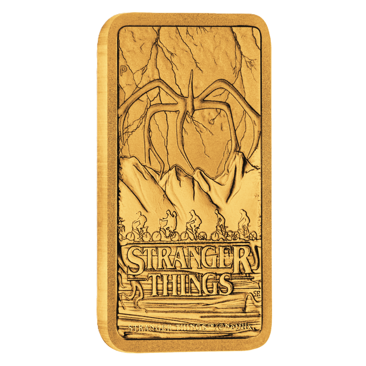 Angled view of the 1 gram gold bar's embossed monster and mountain design face