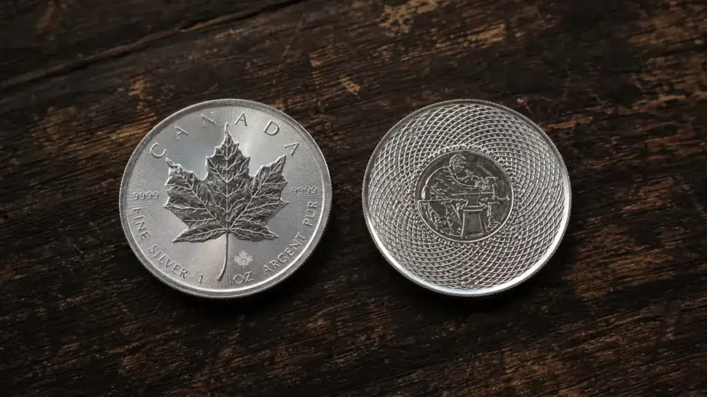 Sovereign coin and private mint silver round side by side on dark walnut, showing mint mark details