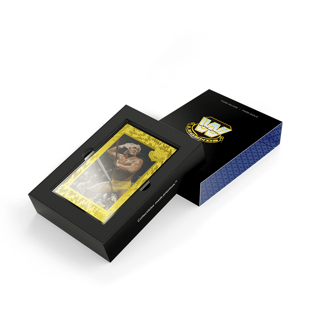 WWE Golden Era Legends blind box opened, gold-framed wrestler foil in a black tray beside its lid